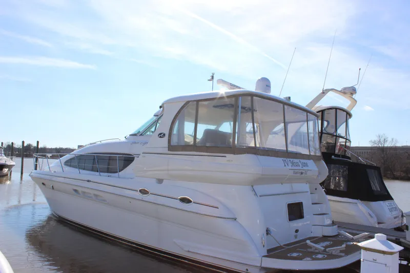 Slide: The Image of 2002 Sea Ray 480 Motor Yacht docked in a marina on a sunny day. - 4