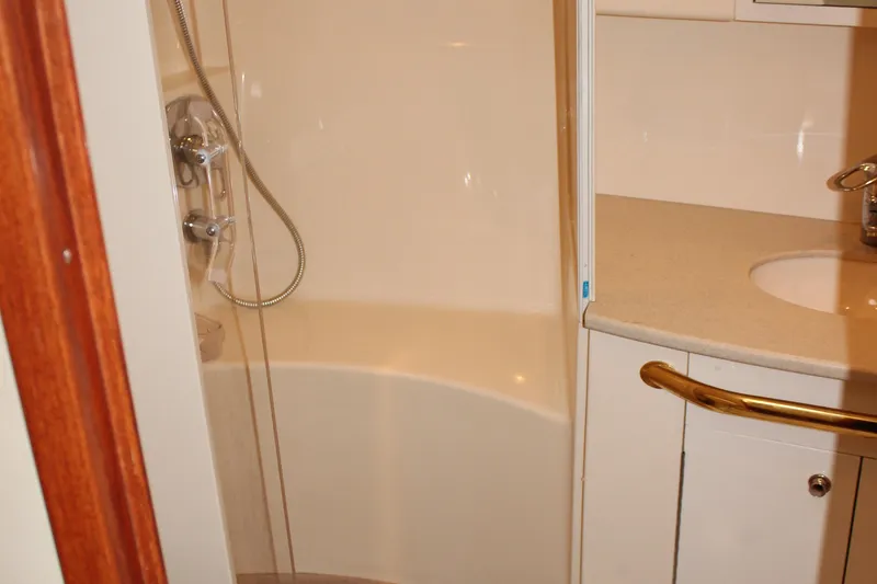 Slide: The Image of 2002 Sea Ray 480 Motor Yacht bathroom with shower and sink. - 41