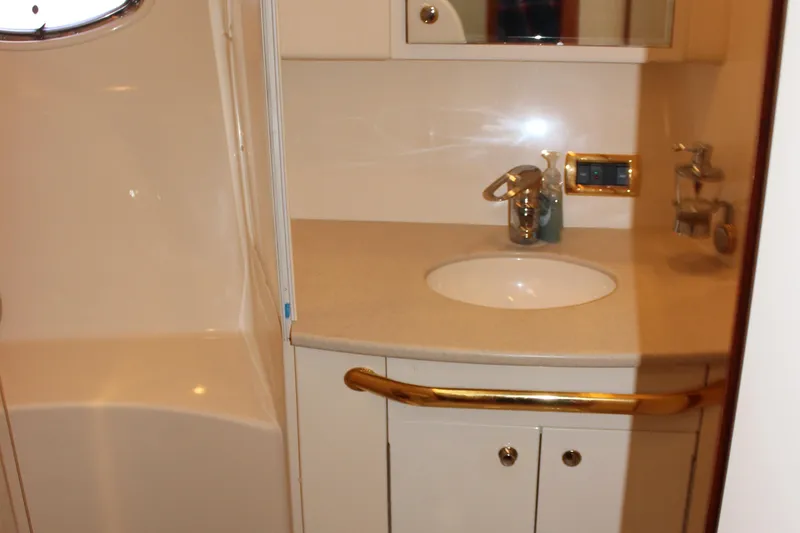 Slide: The Image of Bathroom vanity in 2002 Sea Ray 480 Motor Yacht with sink and mirror. - 43