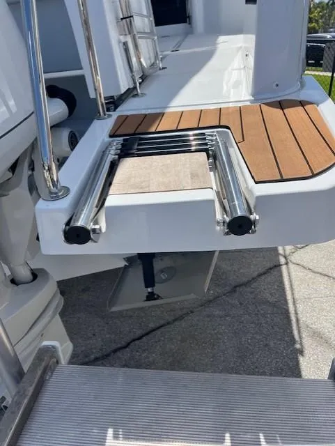 Slide: The Image of 2024 Jeanneau NC Weekender 895 swim platform with ladder. - 20