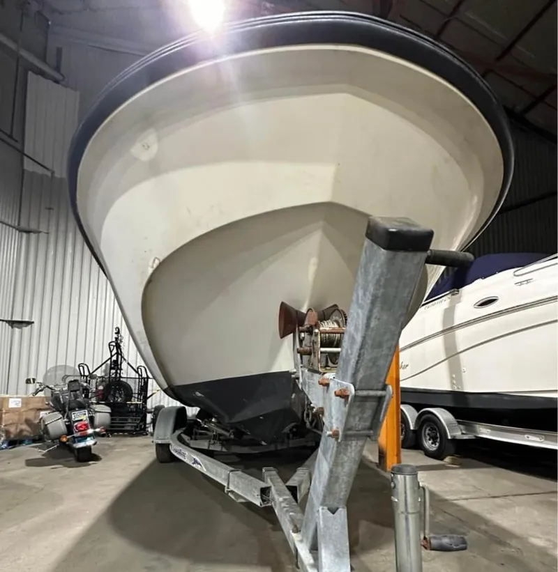 Slide: The Image of 1991 Boston Whaler Outrage Cuddy 22 on trailer in storage facility. - 3