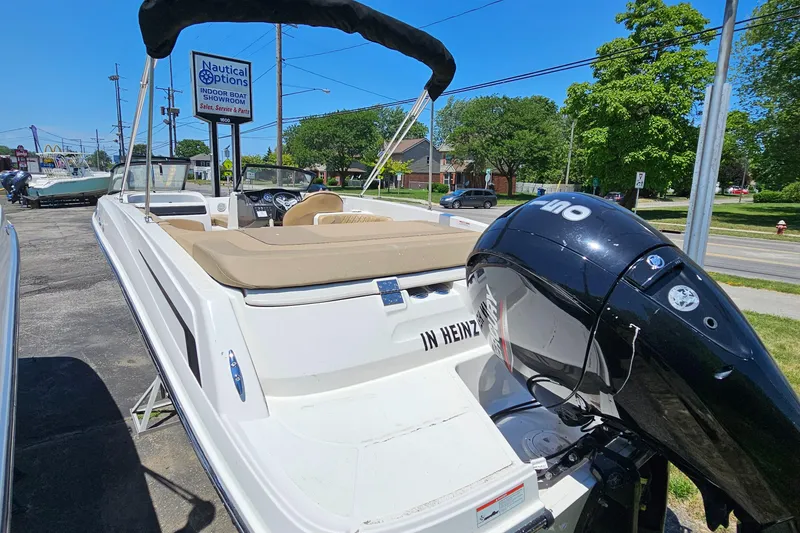 Slide: The Image of 2022 Bayliner VR 6 boat with outboard motor at Nautical Options dealership. - 5