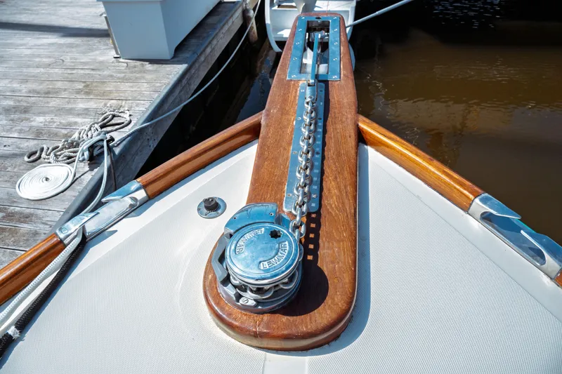 Slide: The Image of Hinckley Picnic Boat Classic 2000 bow with anchor chain and wooden deck detail. - 18