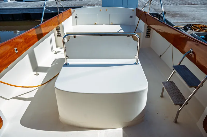 Slide: The Image of 2000 Hinckley Picnic Boat Classic interior with wooden accents and seating area. - 21