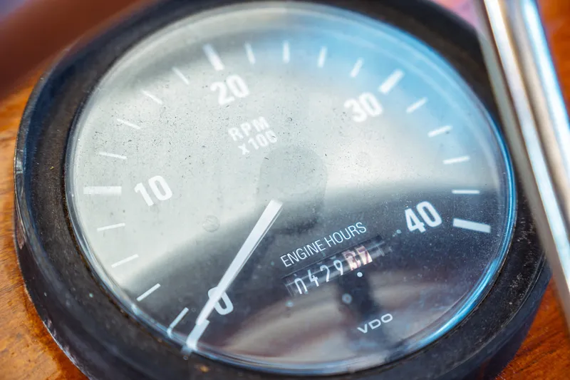Slide: The Image of Close-up of a Hinckley Picnic Boat Classic 2000 tachometer showing RPM and engine hours. - 32
