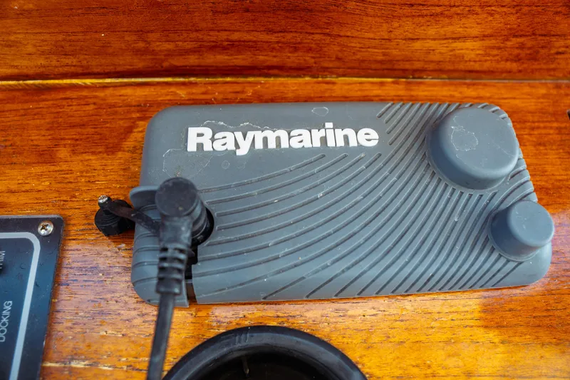 Slide: The Image of Raymarine device on 2000 Hinckley Picnic Boat Classic's wooden dashboard. - 38