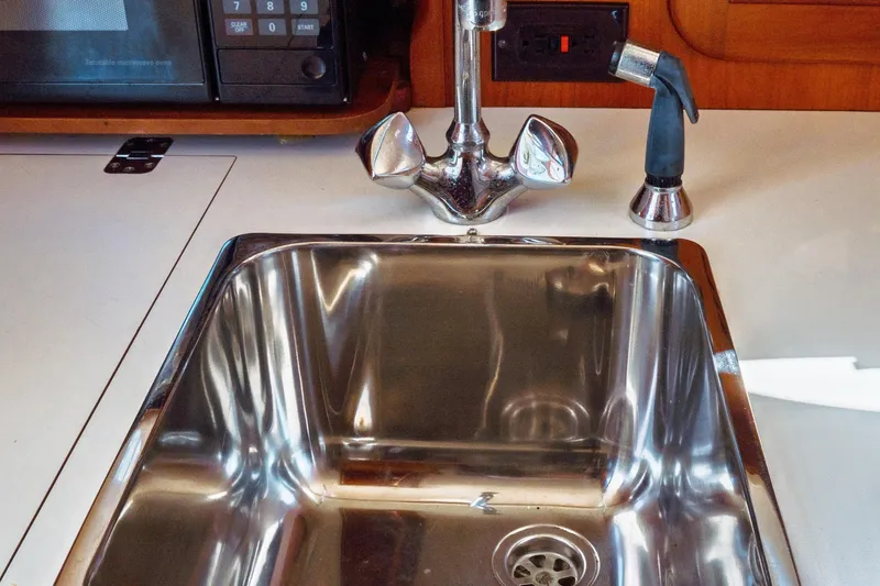 Slide: The Image of Stainless steel sink in 2000 Hinckley Picnic Boat Classic galley. - 47