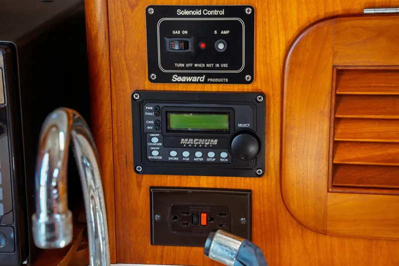 Slide: The Image of Control panel on 2000 Hinckley Picnic Boat Classic with solenoid and electrical controls. - 48