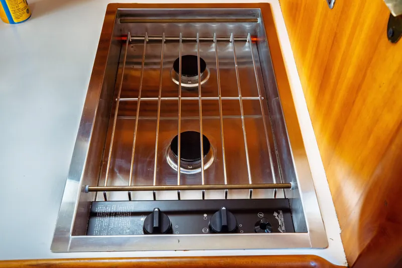 Slide: The Image of Stainless steel stove in 2000 Hinckley Picnic Boat Classic galley. - 49