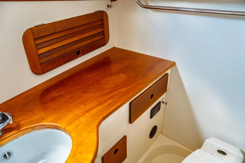 Slide: The Image of Hinckley Picnic Boat Classic 2000 interior with wooden countertop and sink. - 55