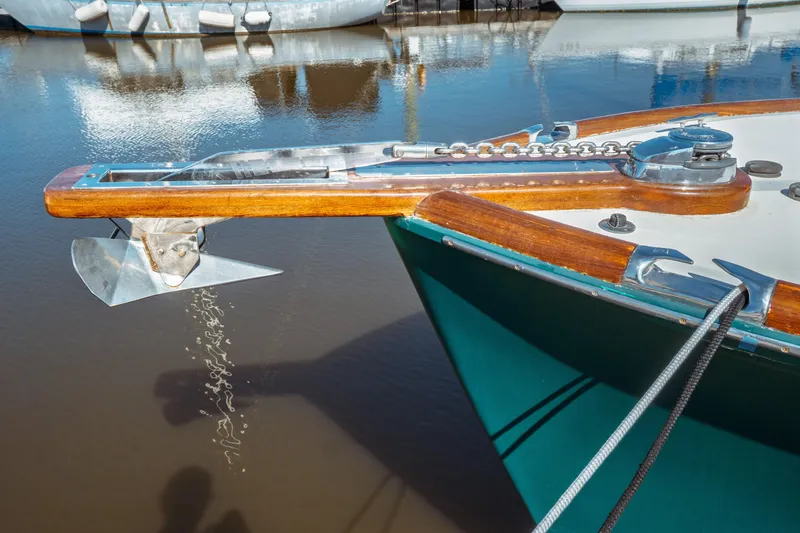Slide: The Image of Bow of 2000 Hinckley Picnic Boat Classic with anchor and chain detail. - 9
