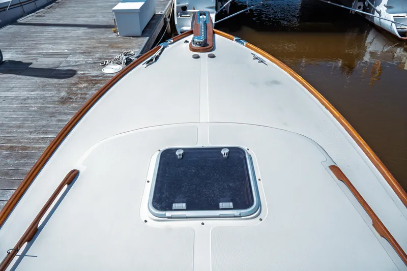 Slide: The Image of Hinckley Picnic Boat Classic 2000, deck view with hatch, docked at marina. - 17