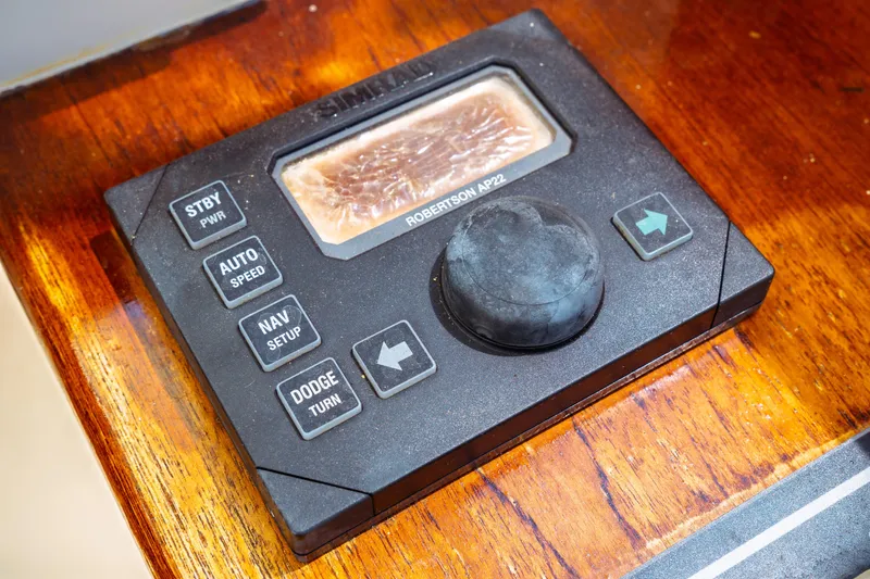 Slide: The Image of Control panel of a 2000 Hinckley Picnic Boat Classic on wooden surface. - 35