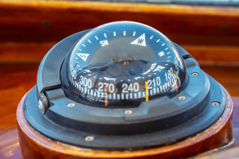 Slide: The Image of Compass on 2000 Hinckley Picnic Boat Classic, showcasing navigation details. - 39