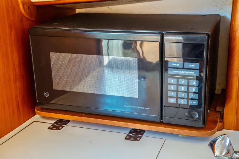 Slide: The Image of Microwave oven inside a 2000 Hinckley Picnic Boat Classic kitchen area. - 45