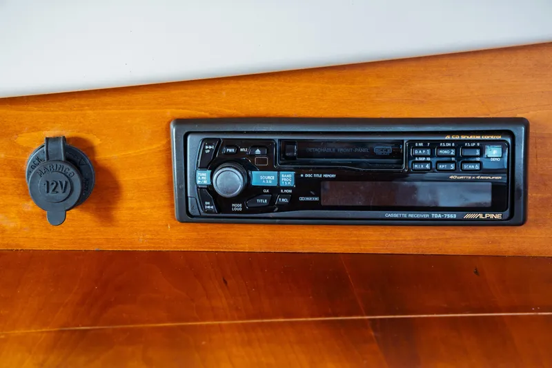 Slide: The Image of Hinckley Picnic Boat Classic 2000 dashboard with Alpine cassette receiver and 12V outlet. - 51