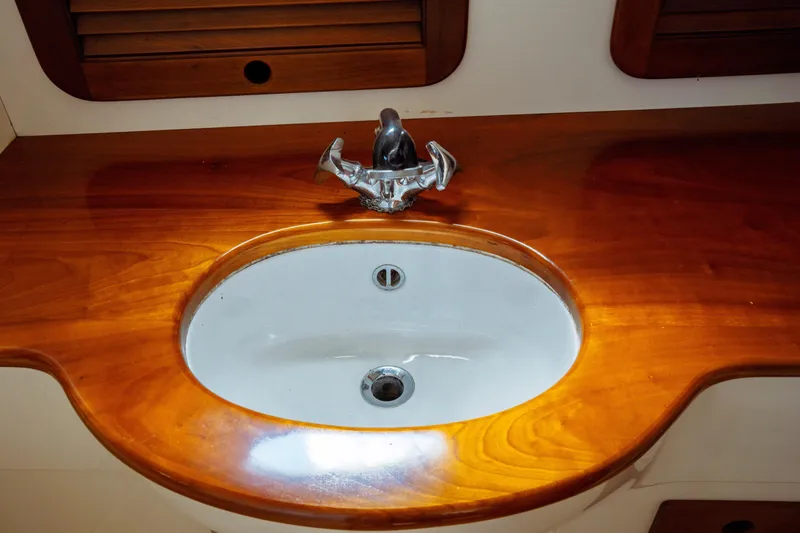 Slide: The Image of Wooden countertop with sink in 2000 Hinckley Picnic Boat Classic. - 54