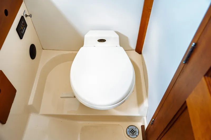 Slide: The Image of Toilet in 2000 Hinckley Picnic Boat Classic, compact marine bathroom design. - 57