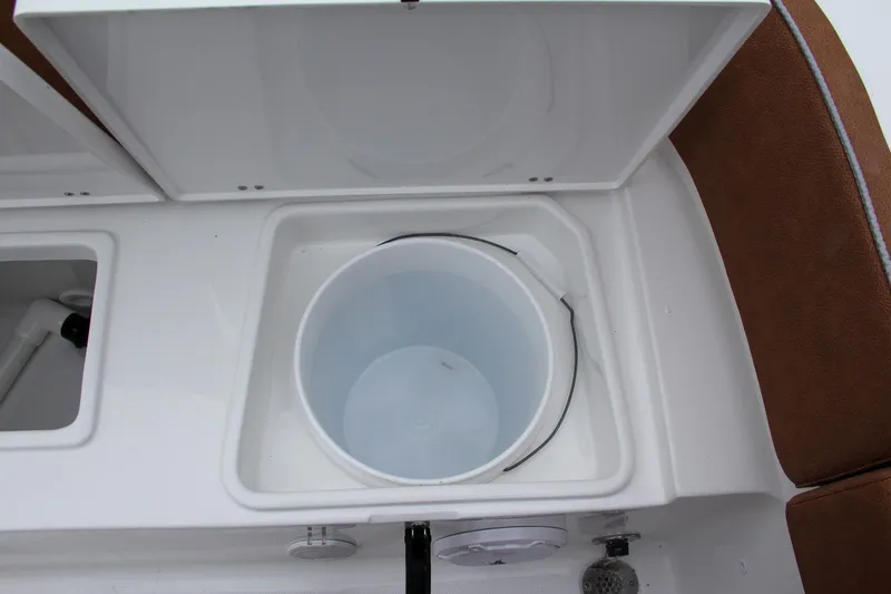 Slide: The Image of Livewell compartment on a 2024 Sea Hunt Ultra 234 boat. - 14