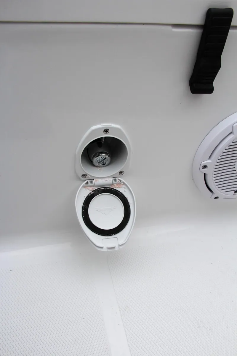 Slide: The Image of Fuel cap and speaker on 2024 Sea Hunt Ultra 234 boat. - 15