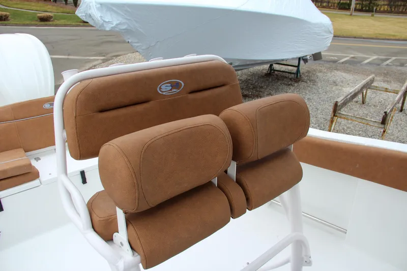 Slide: The Image of 2024 Sea Hunt Ultra 234 boat with cushioned seating. - 21