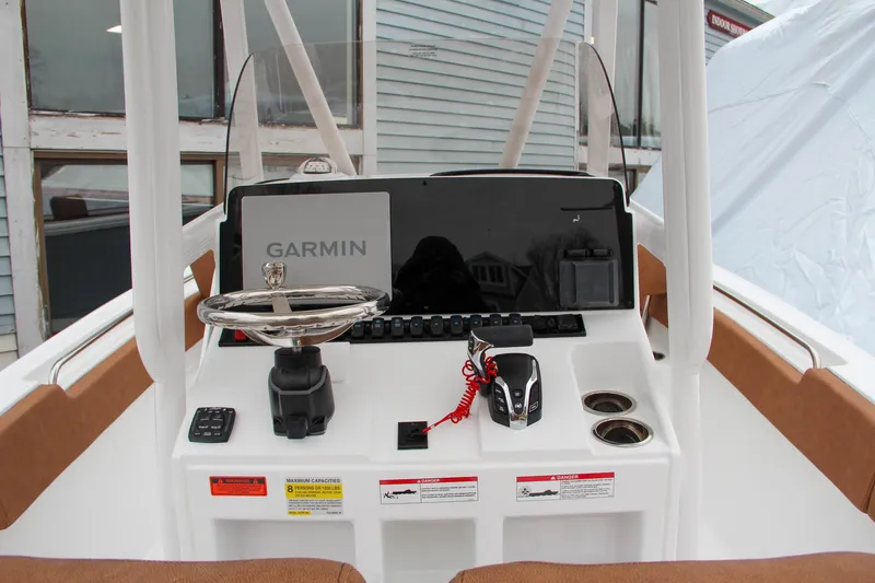 Slide: The Image of 2024 Sea Hunt Ultra 234 boat console with Garmin navigation system. - 23