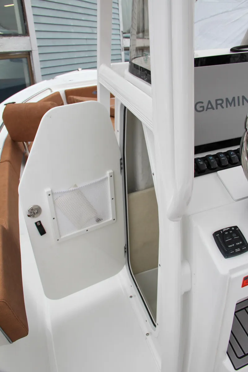 Slide: The Image of 2024 Sea Hunt Ultra 234 boat interior with Garmin electronics. - 27