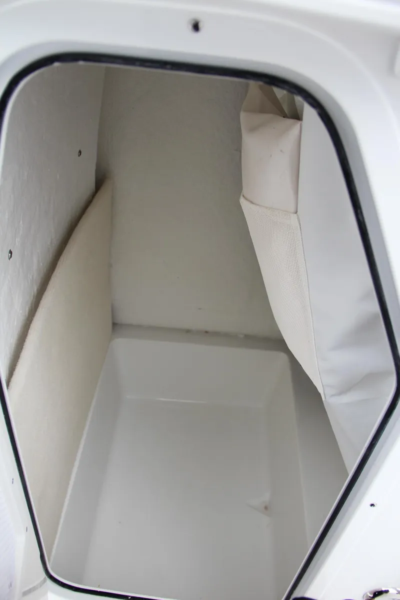Slide: The Image of Storage compartment of 2024 Sea Hunt Ultra 234 boat. - 28