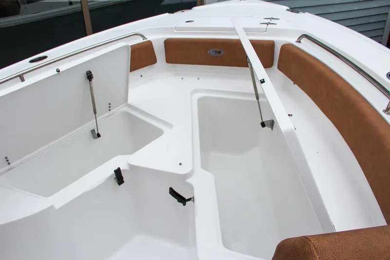 Slide: The Image of 2024 Sea Hunt Ultra 234 boat interior storage compartments. - 35