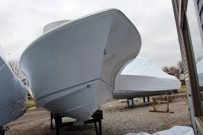 Slide: The Image of 2024 Sea Hunt Ultra 234 boat on stands, front view. - 4