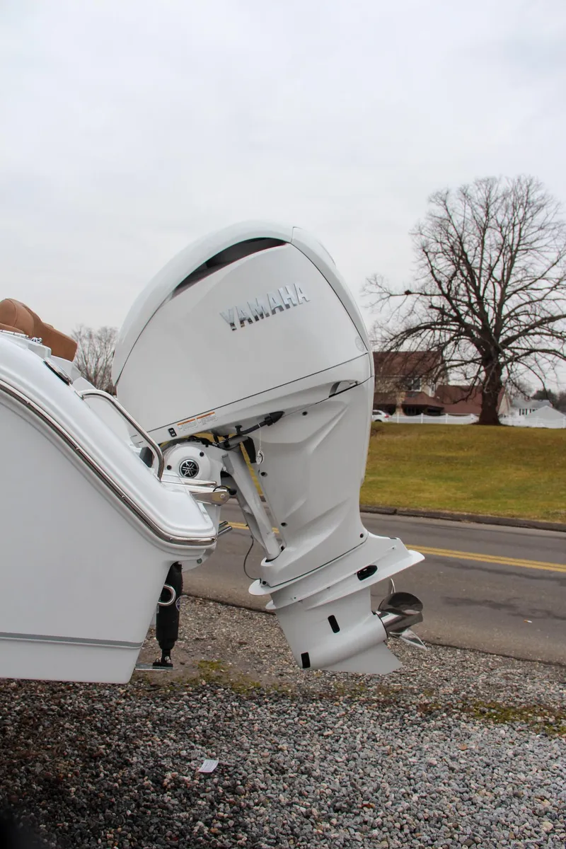 Slide: The Image of 2024 Sea Hunt Ultra 234 boat with Yamaha outboard motor. - 5