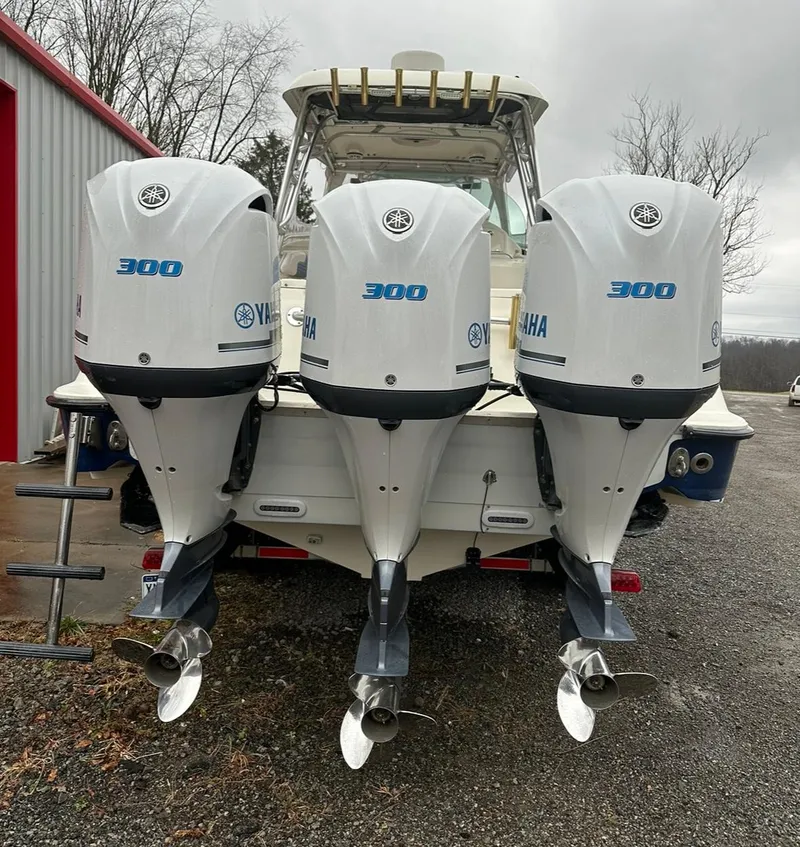 Slide: The Image of 2005 Hydra-Sports Vector 3300 VX with triple Yamaha 300 engines, parked outdoors. - 3