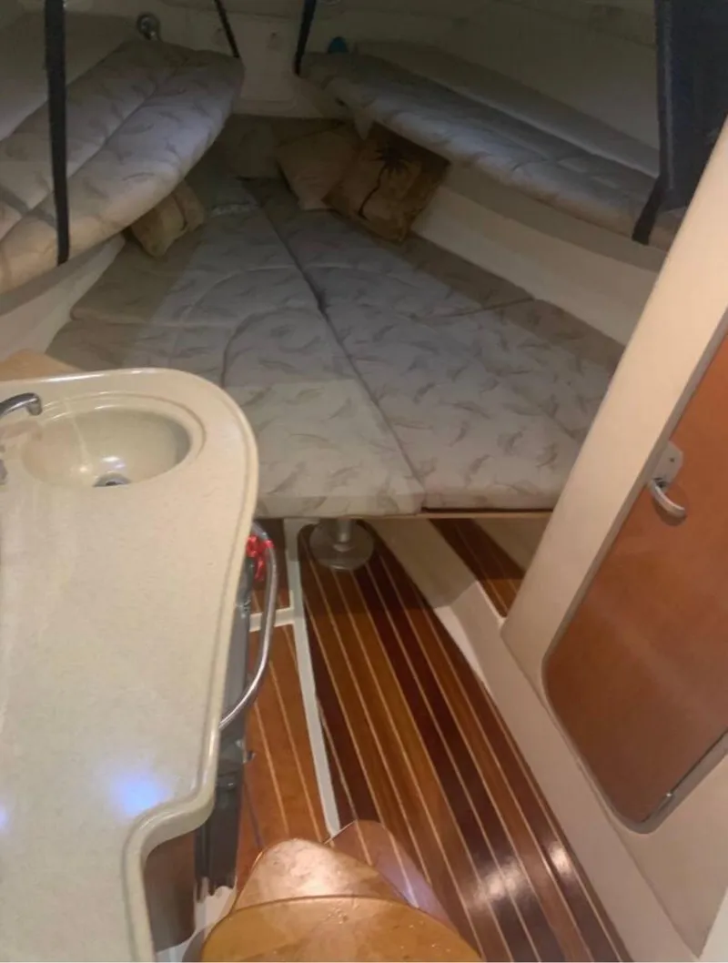 Slide: The Image of 2005 Hydra-Sports Vector 3300 VX cabin interior with bed and sink. - 6