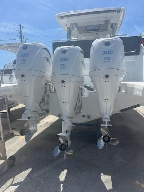 Slide: The Image of 2024 Jeanneau Leader 12.5 WA with triple Yamaha 300 V6 outboard engines. - 19