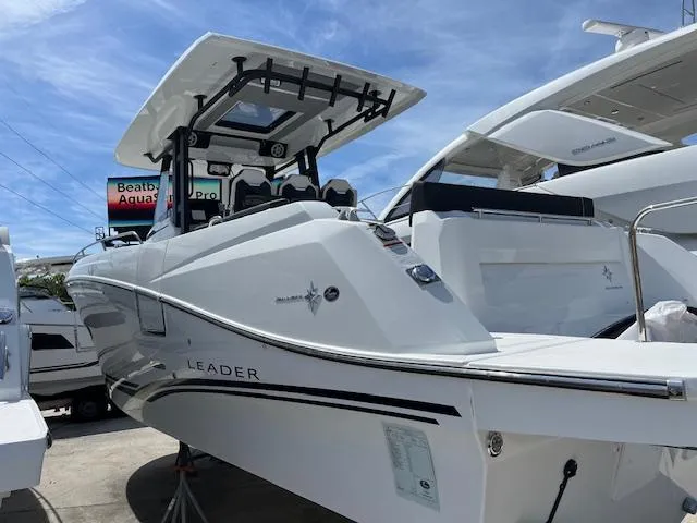 Slide: The Image of 2024 Jeanneau Leader 12.5 WA boat on display under clear sky. - 2
