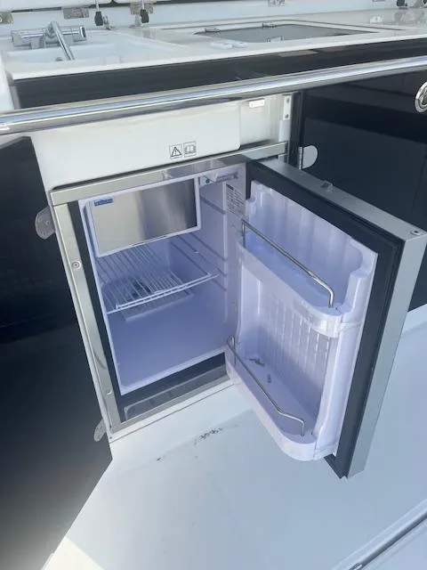 Slide: The Image of 2024 Jeanneau Leader 12.5 WA boat refrigerator open view - 28