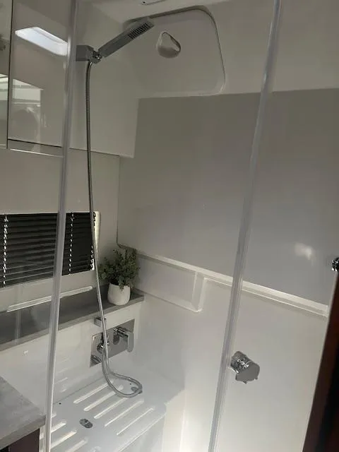 Slide: The Image of 2024 Jeanneau Leader 12.5 WA boat interior shower area. - 34