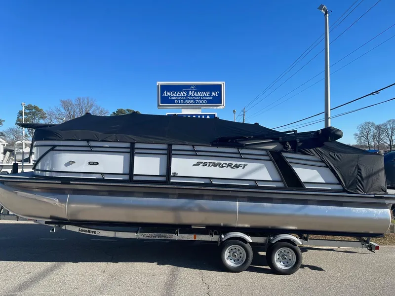 Slide: The Image of 2024 Starcraft SLS3 pontoon boat with black cover at Angler's Marine NC. - 1