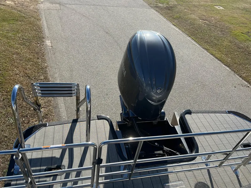 Slide: The Image of 2024 Starcraft SLS3 boat rear view with outboard motor and swim ladder. - 16