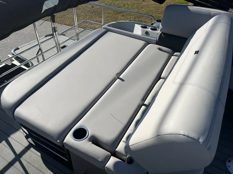 Slide: The Image of 2024 Starcraft SLS3 boat with spacious, cushioned seating and cup holders. - 11