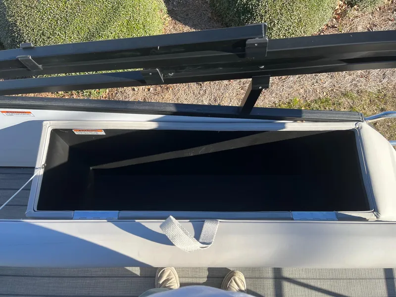 Slide: The Image of Open storage compartment on a 2024 Starcraft SLS3 boat. - 12