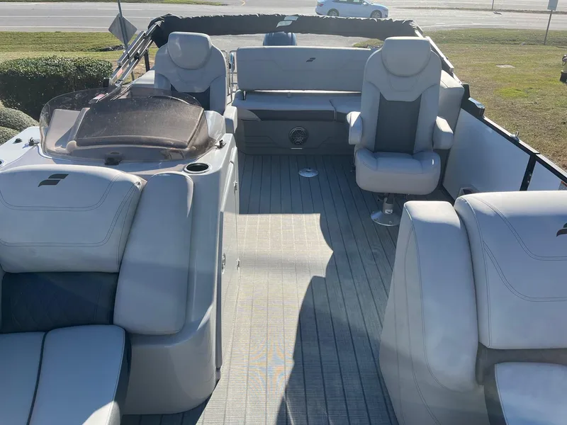 Slide: The Image of 2024 Starcraft SLS3 pontoon boat interior with spacious seating and modern design. - 17