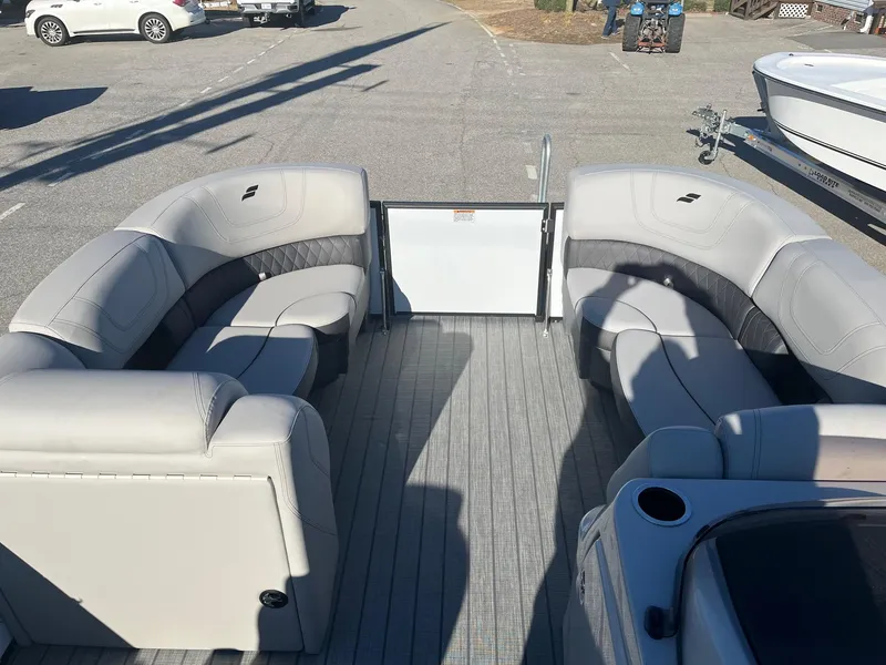 Slide: The Image of 2024 Starcraft SLS3 pontoon boat with spacious seating and modern design. - 5