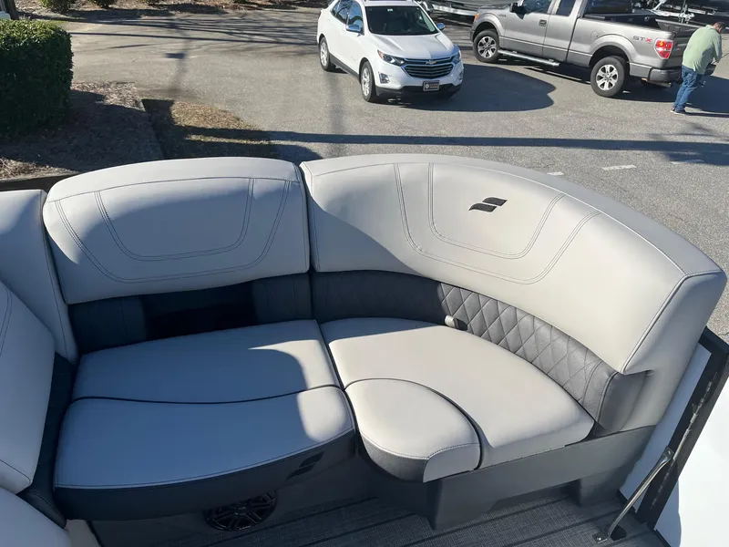 Slide: The Image of 2024 Starcraft SLS3 boat interior seating with gray upholstery. - 2