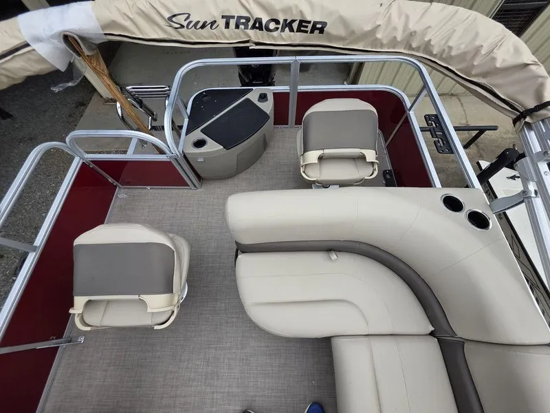 Slide: The Image of 2025 Sun Tracker BASS BUGGY® 18 DLX pontoon boat interior with seating and helm. - 14