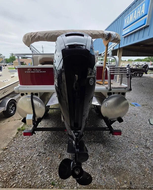Slide: The Image of 2025 Sun Tracker BASS BUGGY® 18 DLX pontoon boat with Yamaha outboard motor, rear view. - 24