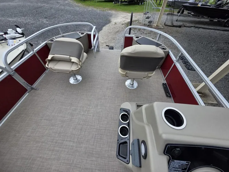 Slide: The Image of 2025 Sun Tracker BASS BUGGY® 18 DLX pontoon boat interior with swivel seats and control panel. - 6