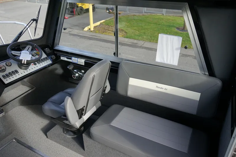 Slide: The Image of Interior of 2024 Thunder Jet 24 Alexis Pro HT boat with steering console and seating. - 11