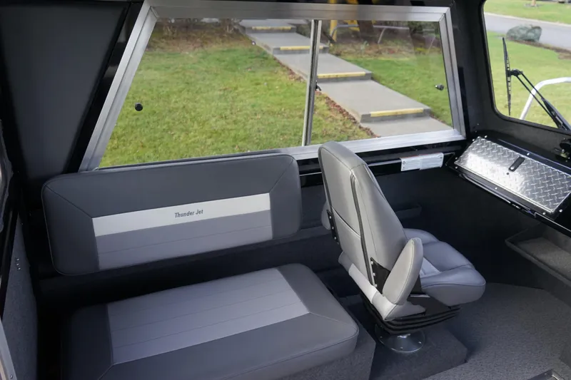 Slide: The Image of Interior of 2024 Thunder Jet 24 Alexis Pro HT boat with seating and window. - 12