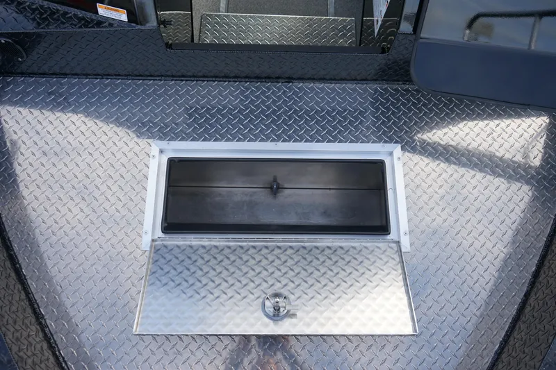 Slide: The Image of 2024 Thunder Jet 24 Alexis Pro HT boat with diamond plate deck and storage compartment. - 14